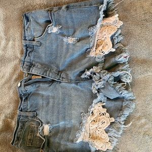 Lace front detail jean shorts.